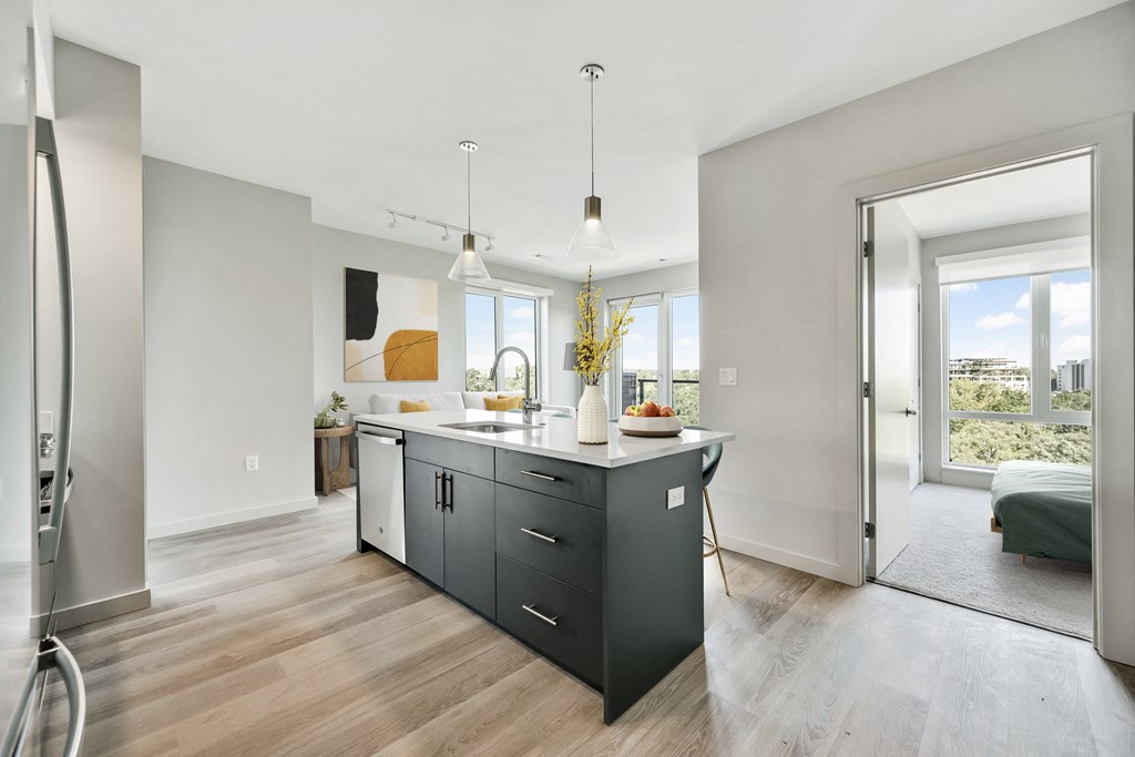 Spacious kitchen with island, and stainless steel appliances