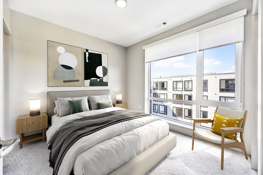 Bright bedroom overlooking community courtyard