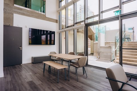 A conference room with a long table and chairs.