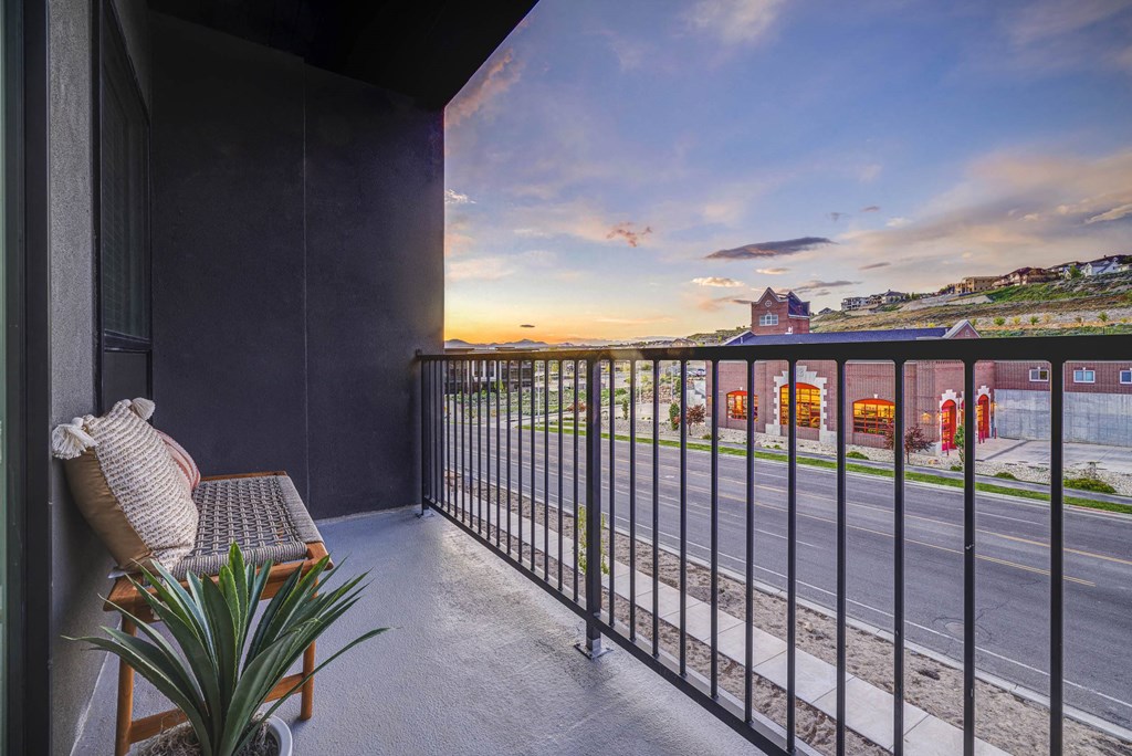 a balcony with a chair and a view of mountains