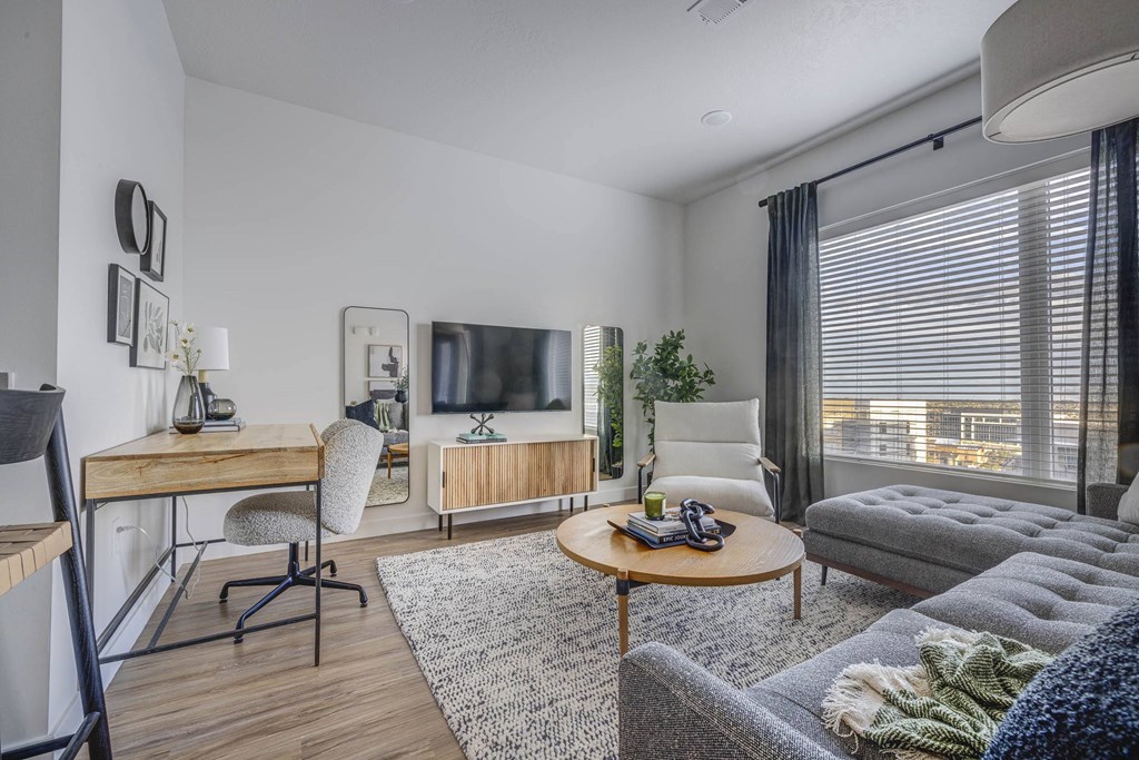 an open living room with a couch and a tv