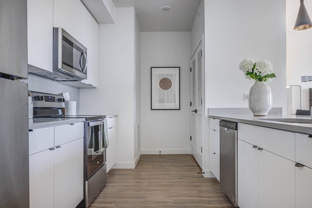 Kitchen with white cabinets and stainless steel appliances