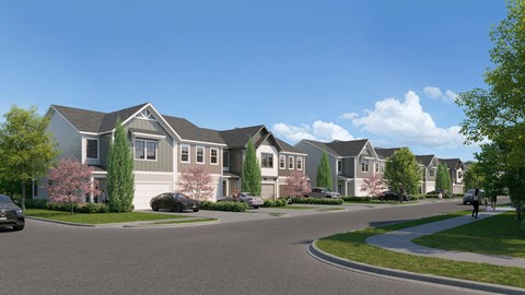 A row of houses with a car parked in front of them.