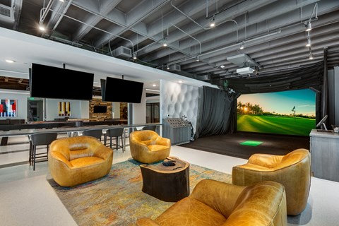 a living room with couches and chairs and a large screen tv