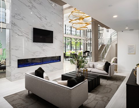 a living room with a couch and a table and a fireplace