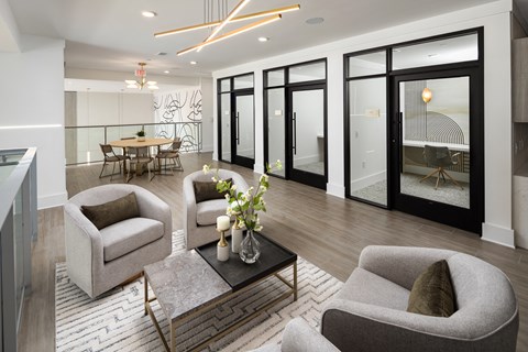 a living room with couches and chairs and a table