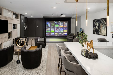 a living room with a tv and a table and chairs