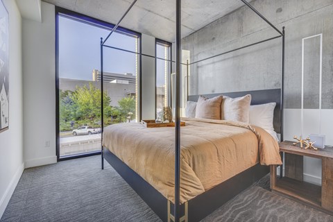 Bedroom with floor to ceiling windows