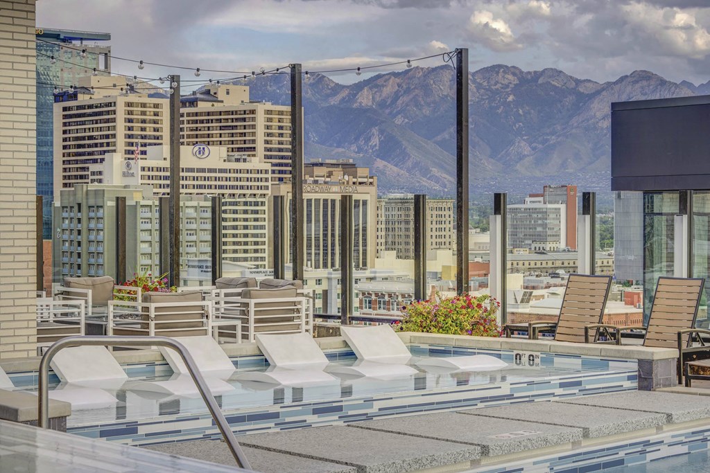 Pool lounge area with a view of the mountains