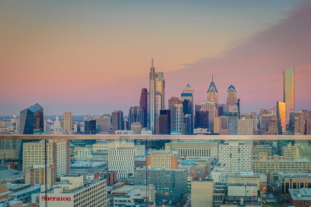 the skyline of the city at sunset