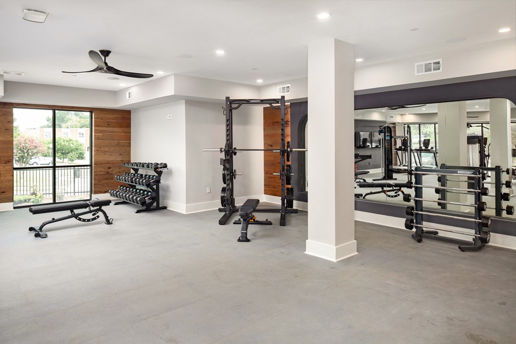 a gym with exercise equipment and a window