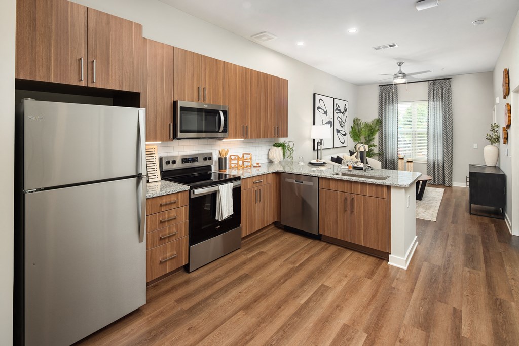 a kitchen with stainless steel appliances and wooden cabinets