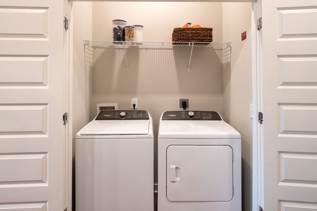 a washer and dryer in a small laundry room
