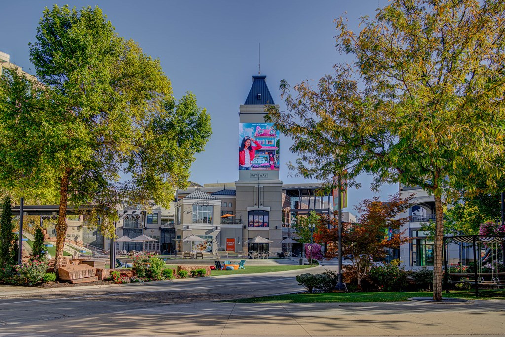 A large building with a tower and a billboard on it.