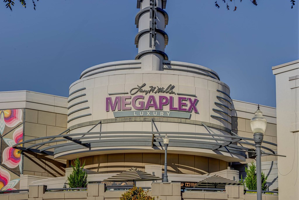 The Megaplex Luxury building has a large sign on the front.