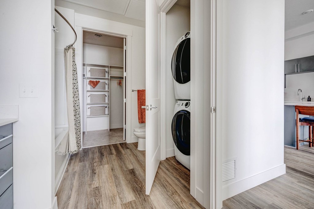 A laundry room with a washer and dryer in it.