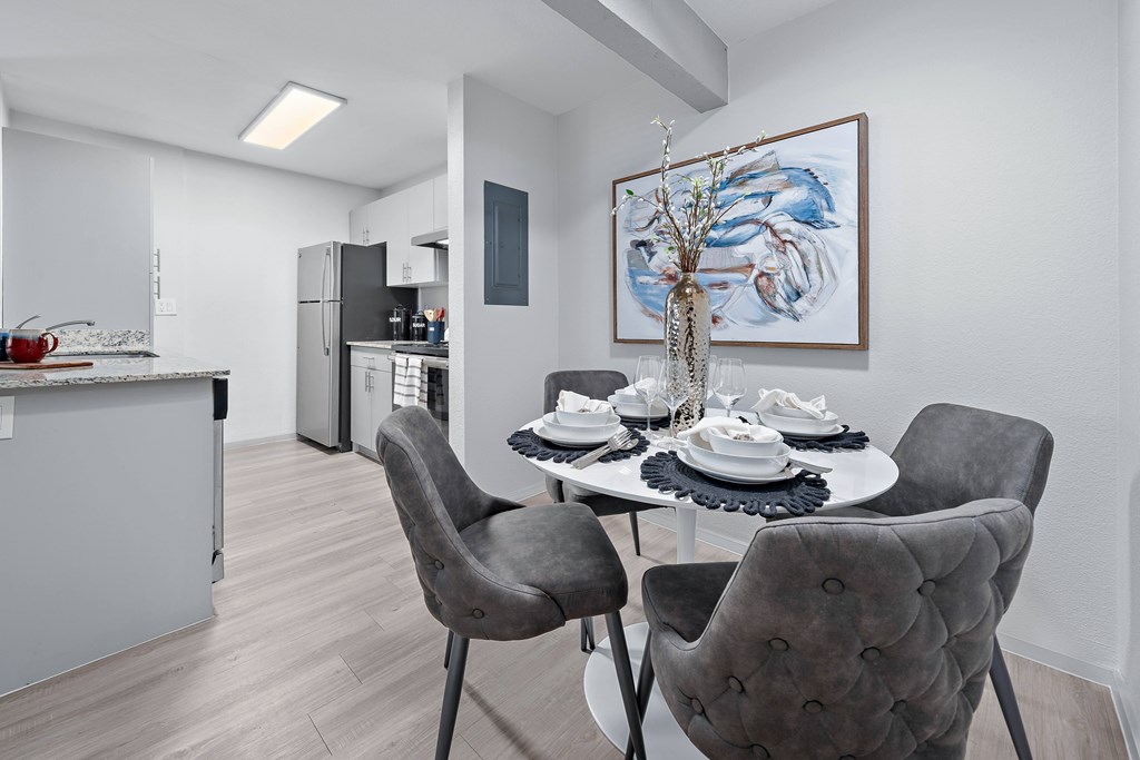 Dining area with table and chairs at The Halifax apartments in Phoenix, AZ.