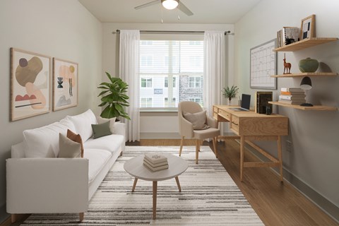 a living room with a white couch and a table