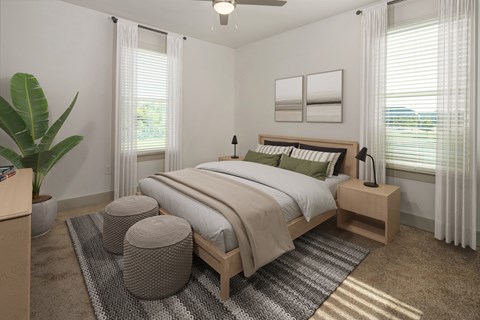 a bedroom with a bed and two windows