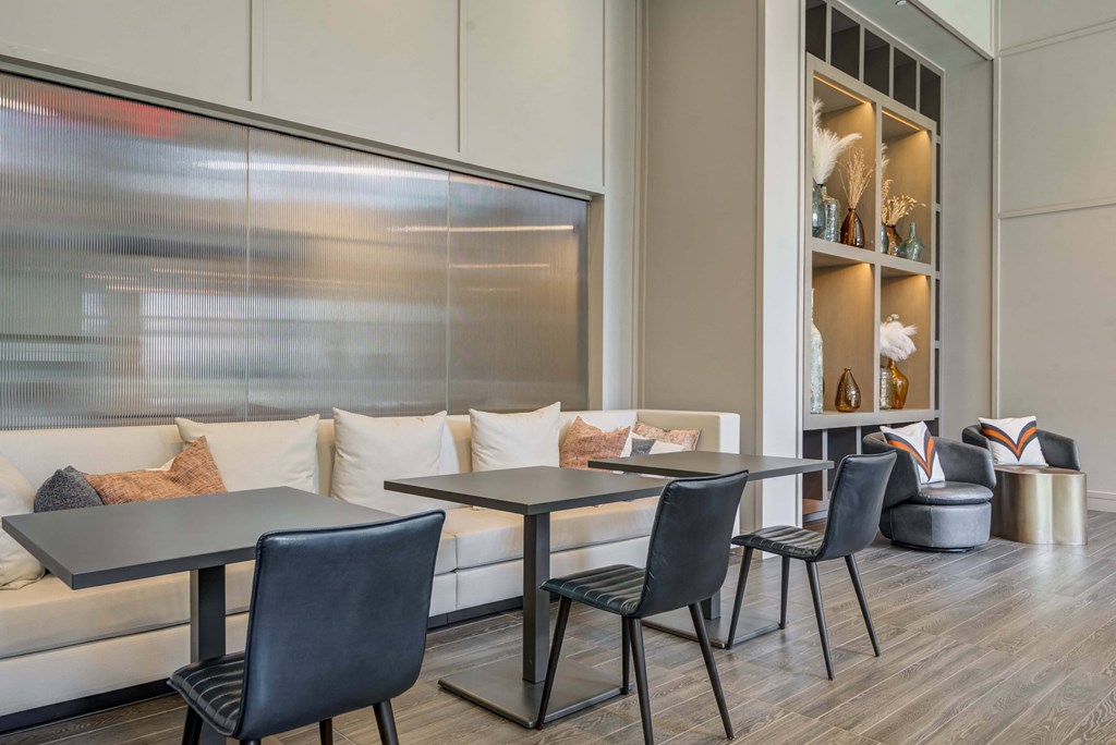 a room filled with furniture and a large window