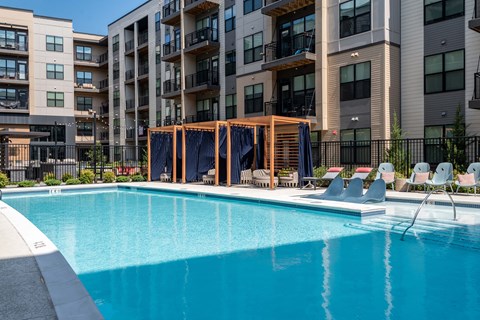 an image of an apartment complex with a swimming pool