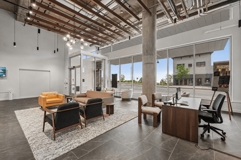 A modern office space with a wooden ceiling and furniture.