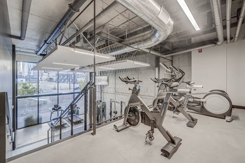 the gym at the district flats apartments in lenexa