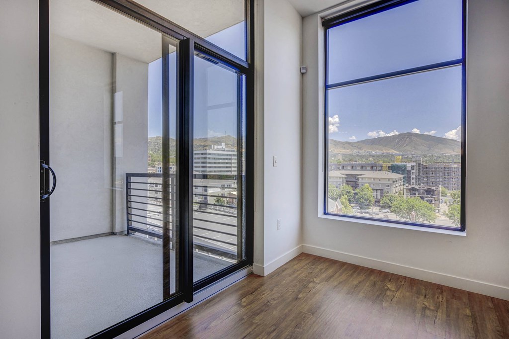 Glass sliding patio door, large window, wood flooring