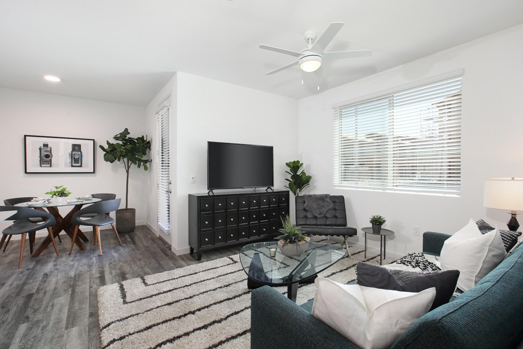 a living room with a couch and a table and a tv