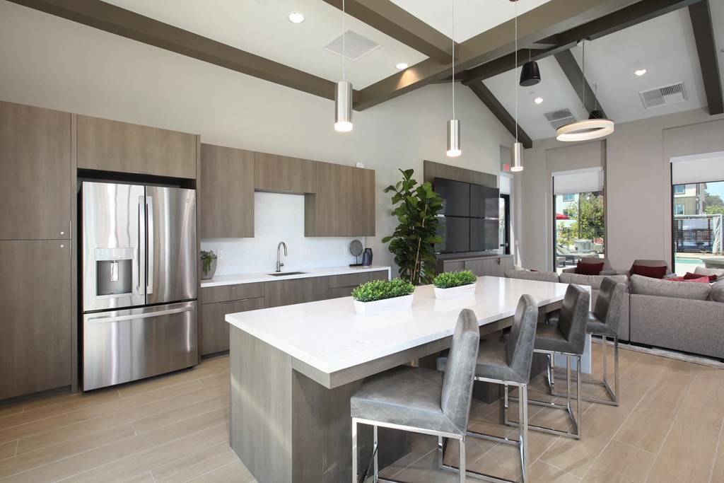 a kitchen with stainless steel appliances and a white counter top