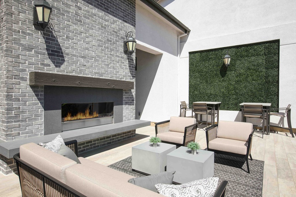 a living room with couches and tables and a fireplace