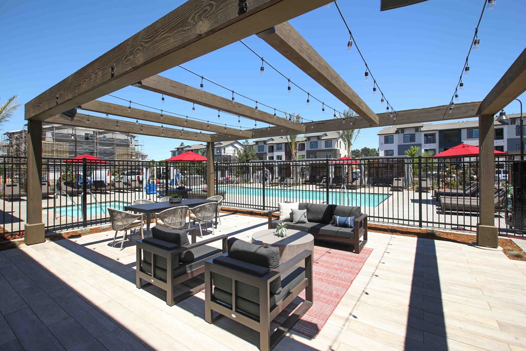 a patio with furniture and a swimming pool