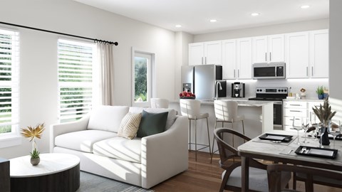 A modern kitchen with white cabinets and appliances, a dining table with chairs, and a living area with a sofa and a coffee table.