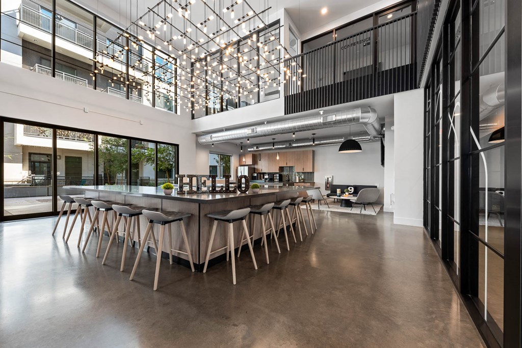 a large dining room with a long table and chairs