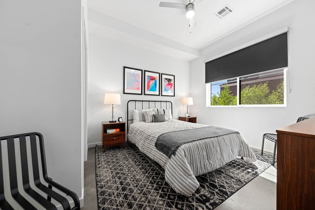 a bedroom with a bed and a window