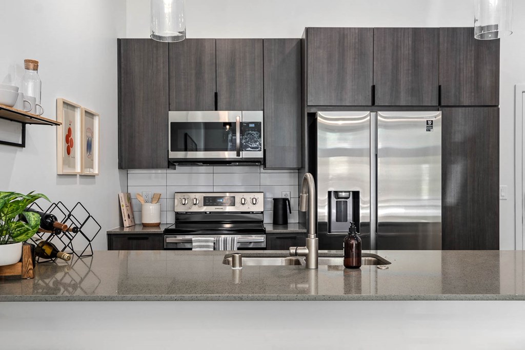 a kitchen with stainless steel appliances and a counter top