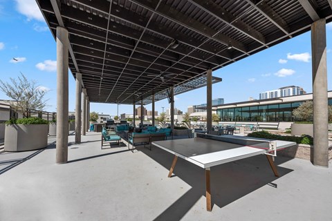 a ping pong table is under awnings on a patio with a ping
