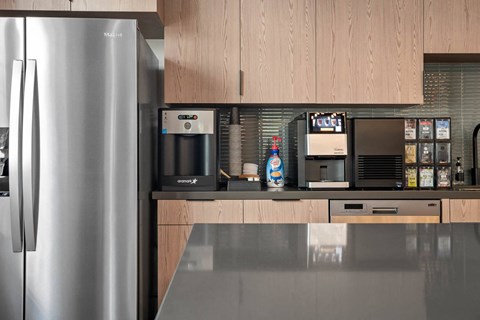 a kitchen with stainless steel appliances and wooden cabinets