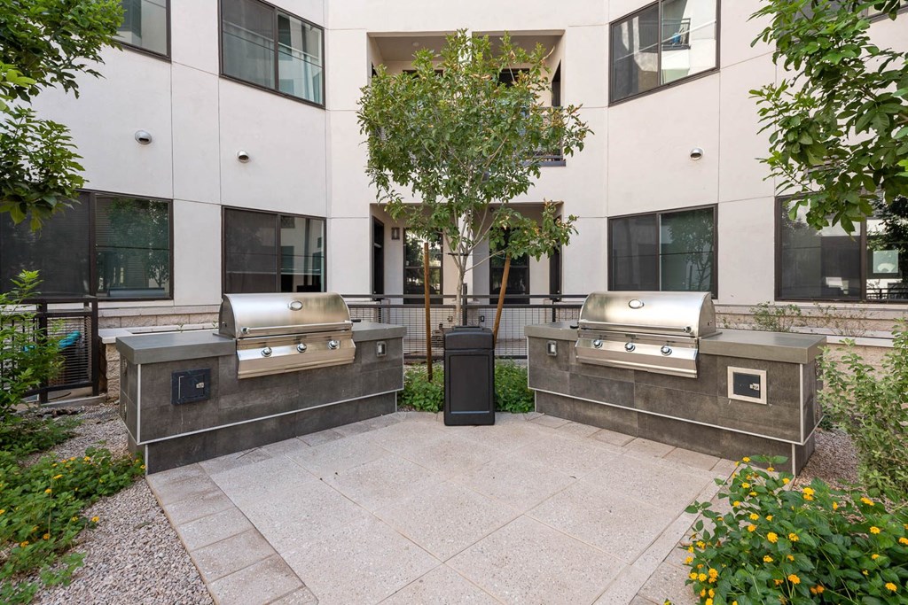 two bbq pits in front of an office building