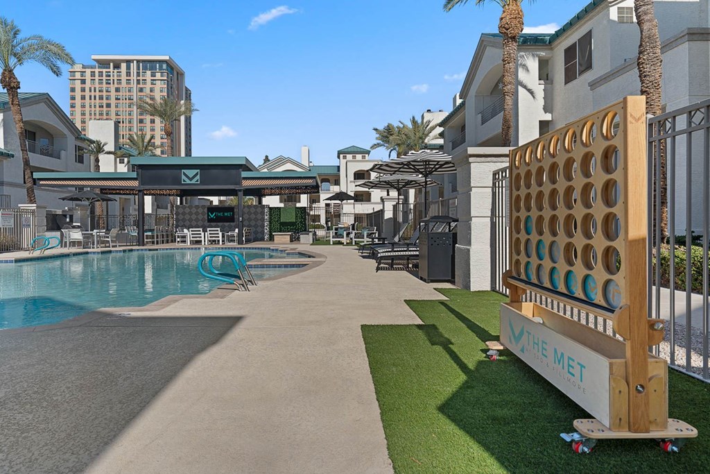 A pool area with a sign that says "The Met" on it.