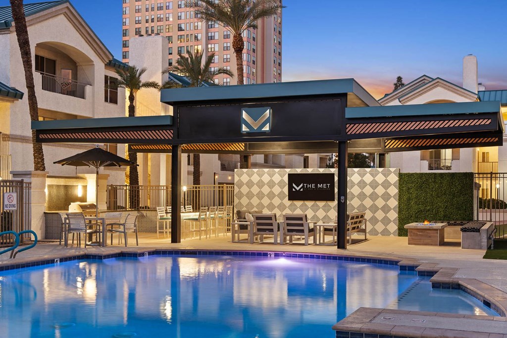 A pool area with a black awning and a sign that says "The Met".