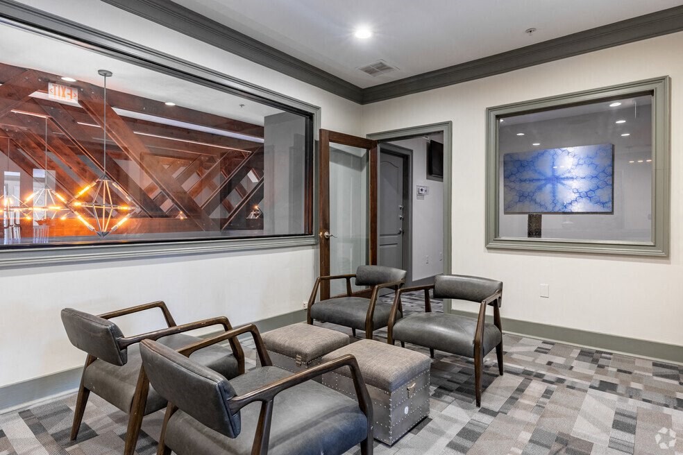 a waiting room with chairs and a large window