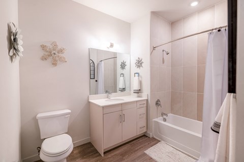 a bathroom with a toilet sink and bathtub