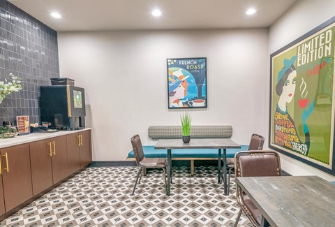 a dining area with a table and chairs and a television