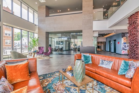 a large lobby with couches and chairs