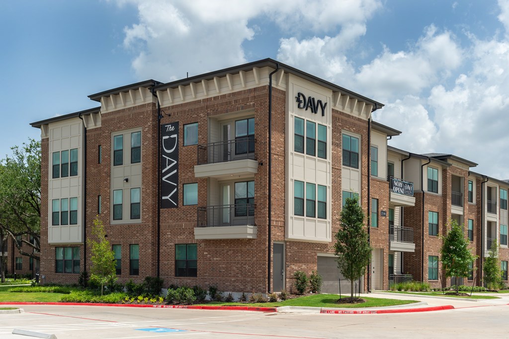 The exterior of a brick apartment building with the name "The DAVY" on it.