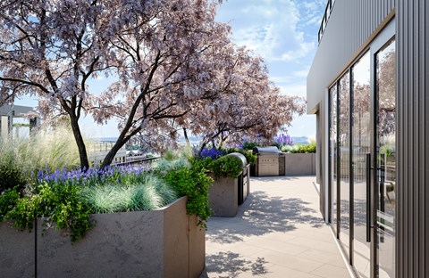 A modern building with a concrete planter in front of it.