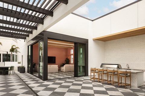 a patio with a dining area and a bar with tables and chairs