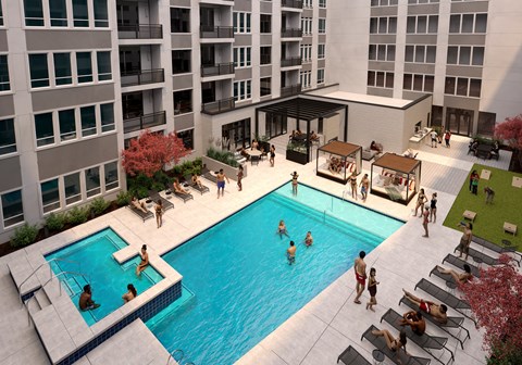 A group of people are enjoying the sun by the pool.