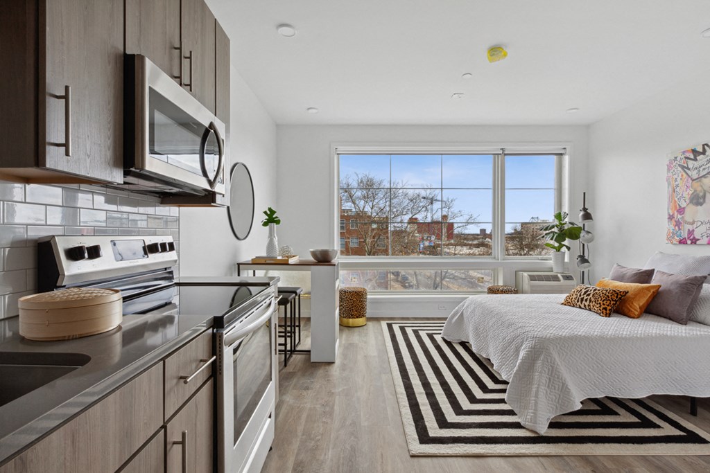 a bedroom with a bed and a window